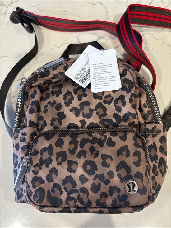 lululemon athletica Handbags - lululemon athletica Leopard Print Mini Backpack with Red-Striped Strap
